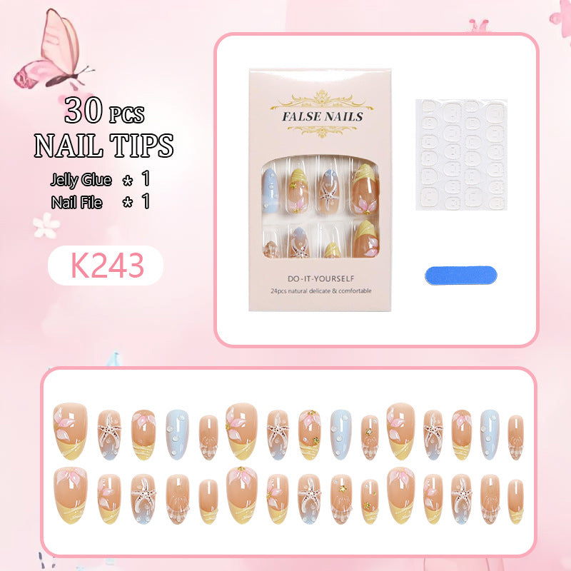 Artificial nails with floral motifs and glitter details Stornfield