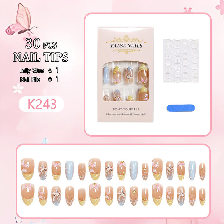 Artificial nails with floral motifs and glitter details Stornfield