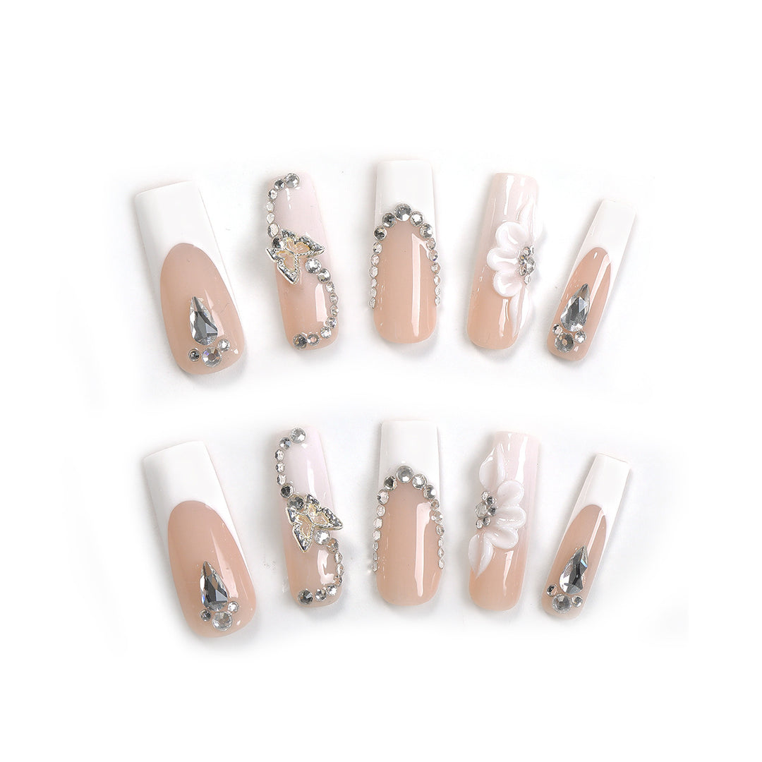 Artificial nail set with elegant glitter and flower motifs Stornfield