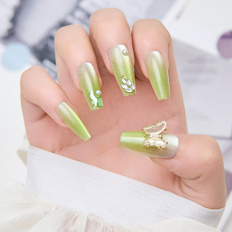 Artificial nails with butterfly accents and glitter details Stornfield