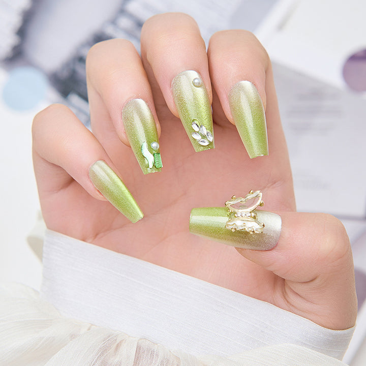 Artificial nails with butterfly accents and glitter details Stornfield