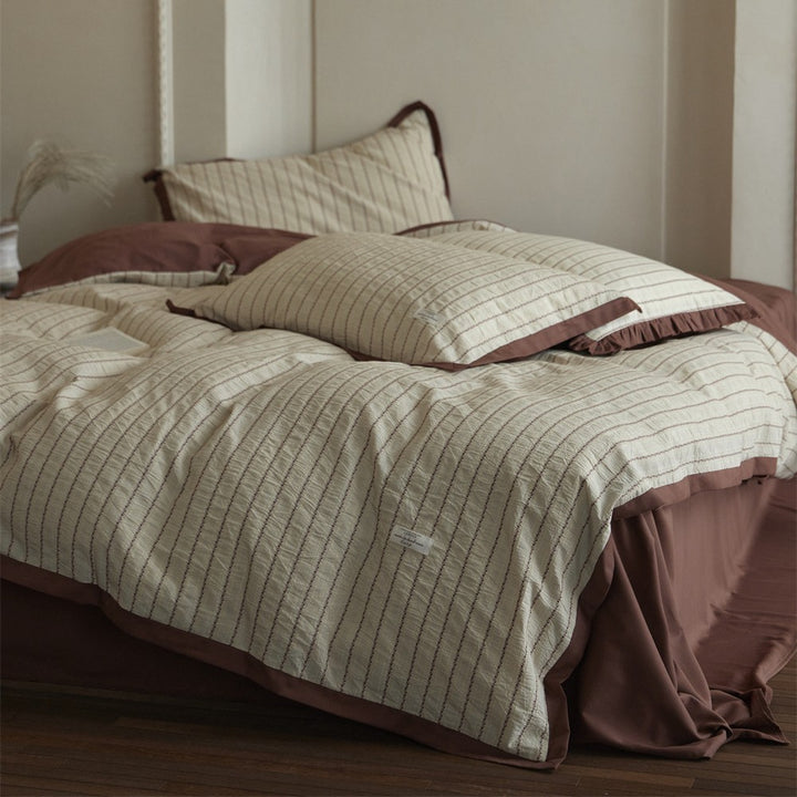 Luxurious cotton bedding set with ruffled trim and pillowcases