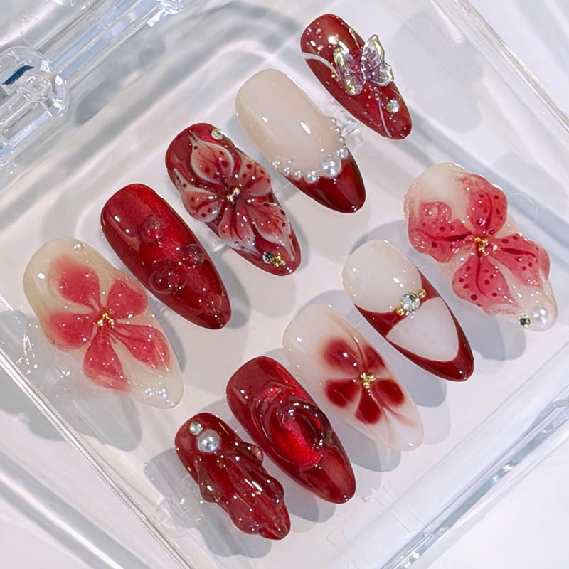 Artificial nail set with floral designs and glamorous accents Stornfield