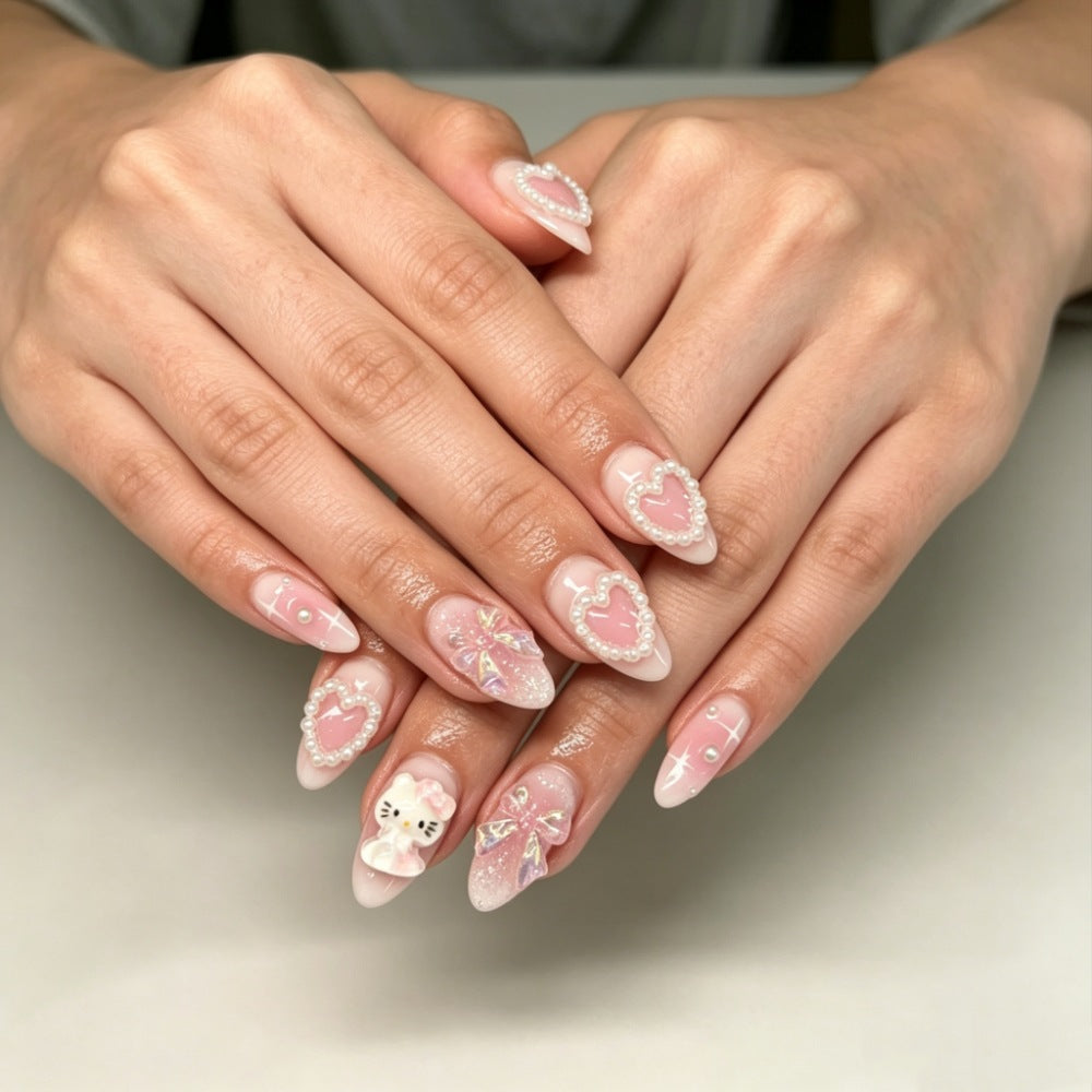 Playful artificial nails with heart and kitty motifs Stornfield