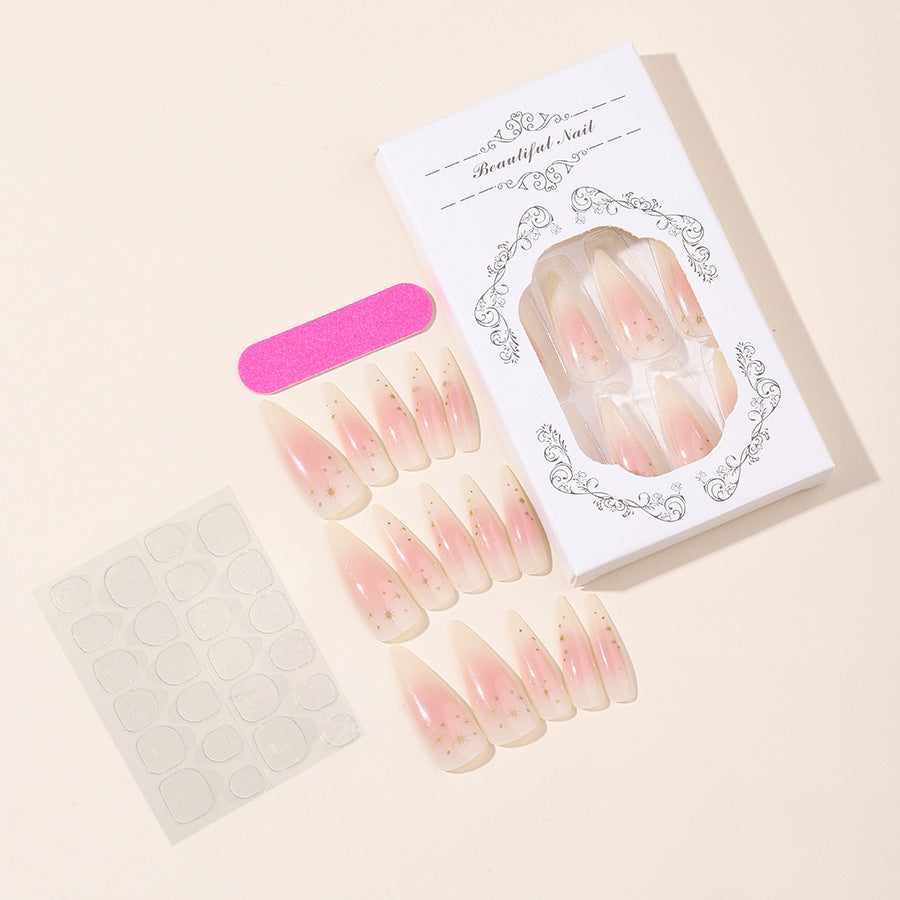 Acrylic nail set with delicate ombre design and glamorous star accents Stornfield