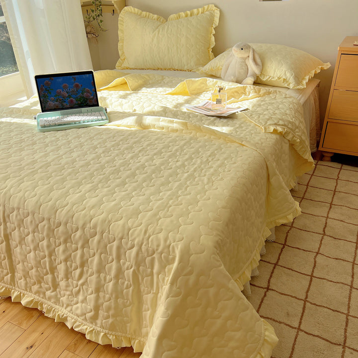 Quilted bedspread set with frill edge and heart quilting pattern