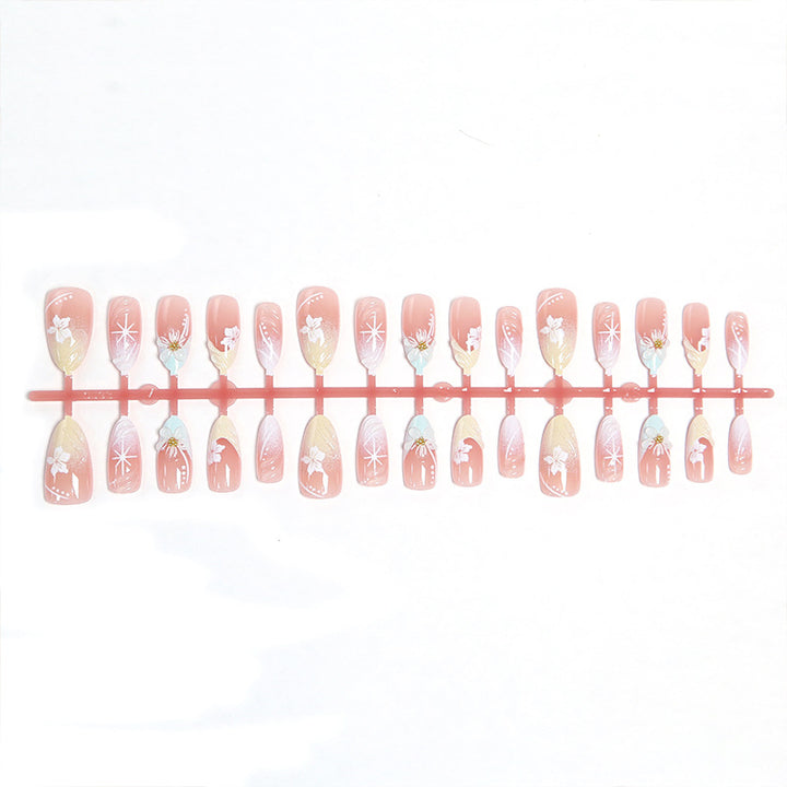 Artificial nail set with intricately detailed floral designs and shine accents Stornfield