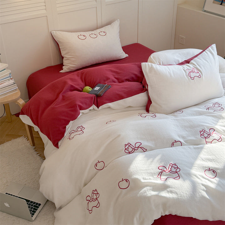 Quilted comforter with delicate bird and cloud embroidery
