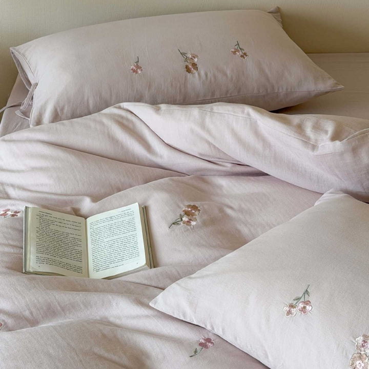 Breathable cotton bedding set with delicate flower embroidery and tie ribbon pillow