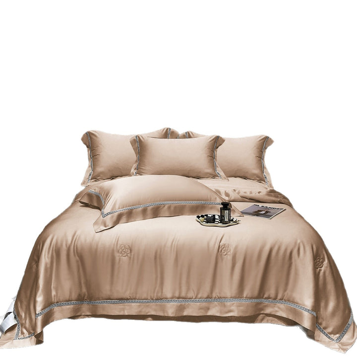 Luxurious satin bedding set with fine embroidered border and tone-on-tone floral relief