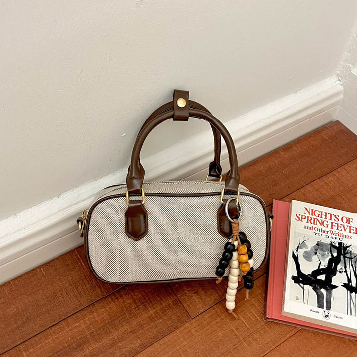 Vintage-Inspired Glossy Handheld Satchel