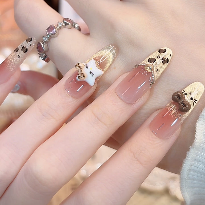 Artificial nail set with festive gift design and elegant glitter accents Stornfield