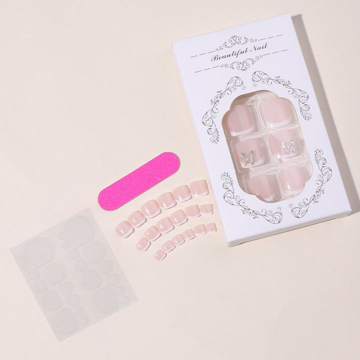 Artificial nail set with delicate decorations and glitter designs Stornfield