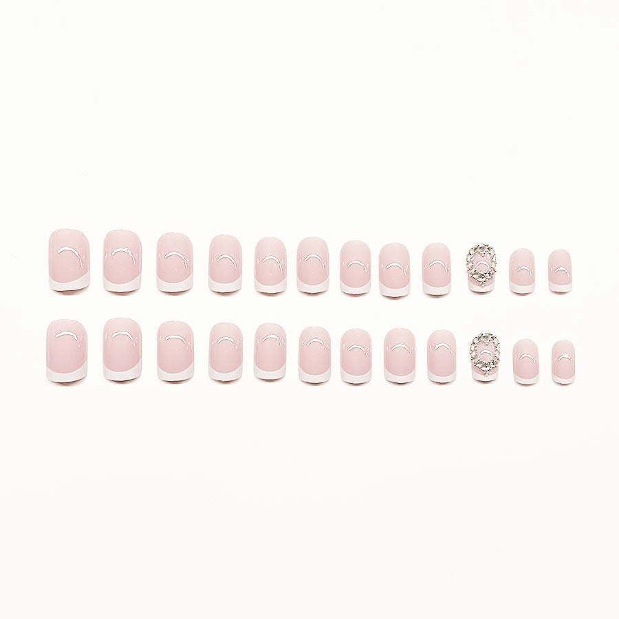 Artificial nail set with elegant French design and rhinestone embellishments Stornfield
