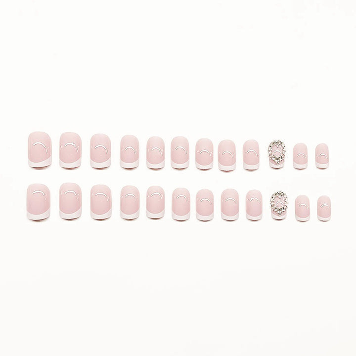 Artificial nail set with elegant French design and rhinestone embellishments Stornfield