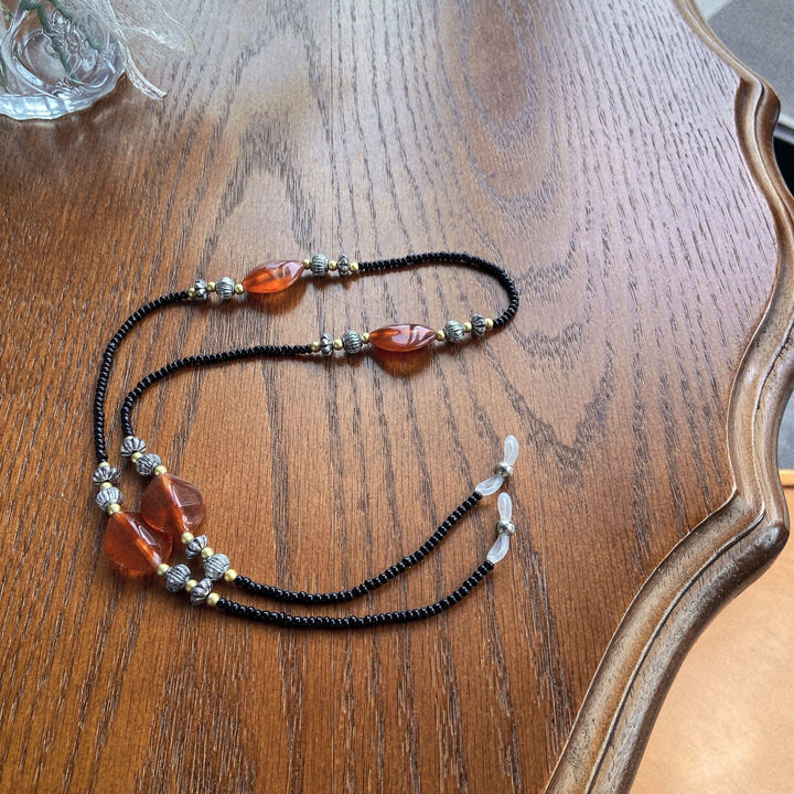 Stylish glasses holder chain with colorful accents Stornfield