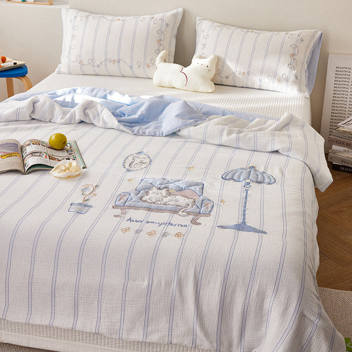 Quilted bedding and throw set with appliquéd plush puppy made of cotton muslin