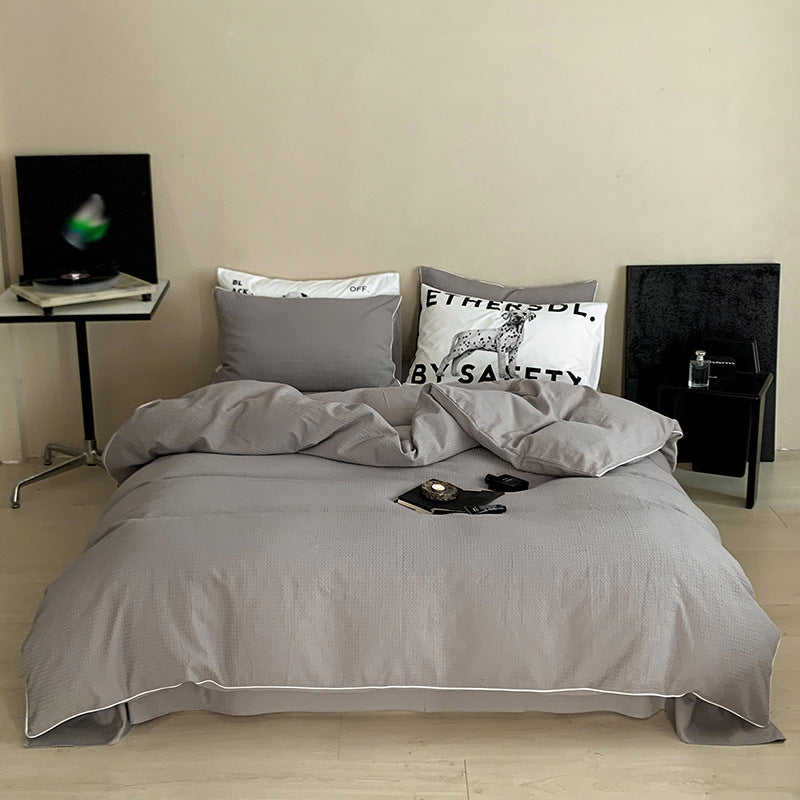 Textured cotton waffle duvet cover with pillowcases and fine contrasting piping