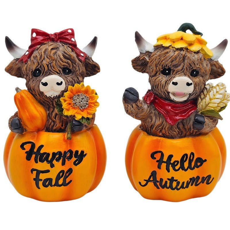 Funny decorative figure of a Highland cow in pumpkin costume Stornfield