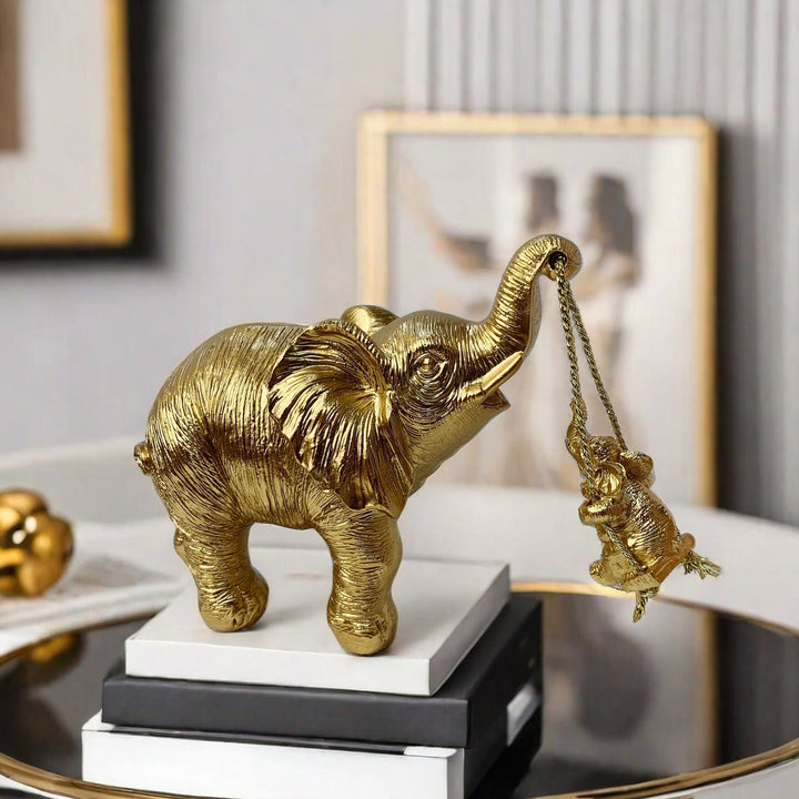 Decorative elephant figure with child Stornfield