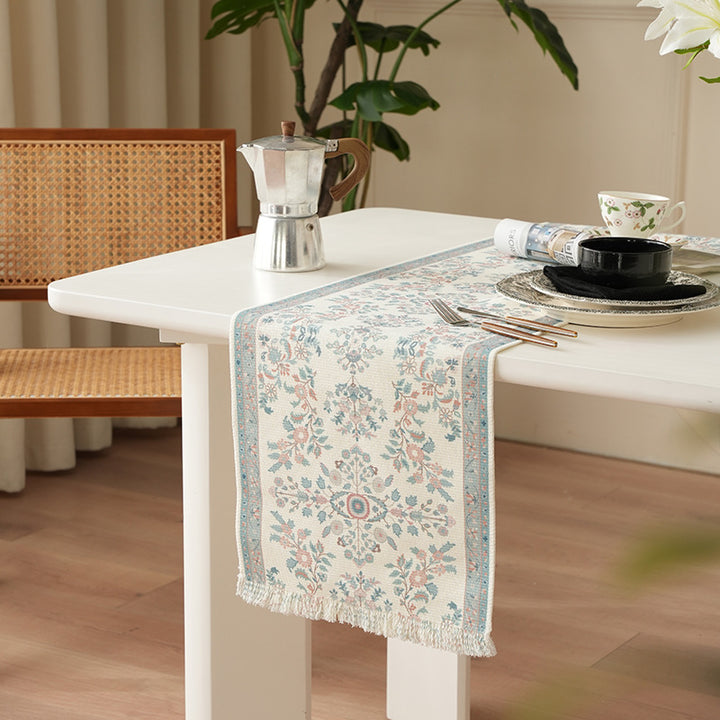 Woven jacquard table runner with floral medallion and fringes Stornfield