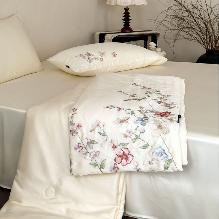 Luxurious bed linen set made of cotton satin with tonal floral embroidery and hotel closure