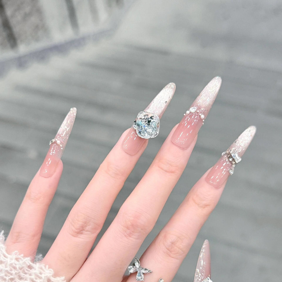 Artificial nails with glitter and crystal embellishments Stornfield