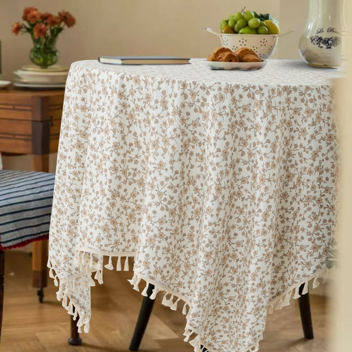 Rectangular tablecloth made of cotton-linen blend with delicate floral print and tassels