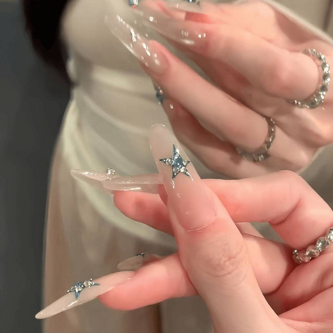 Glamorous artificial nails with star accents Stornfield