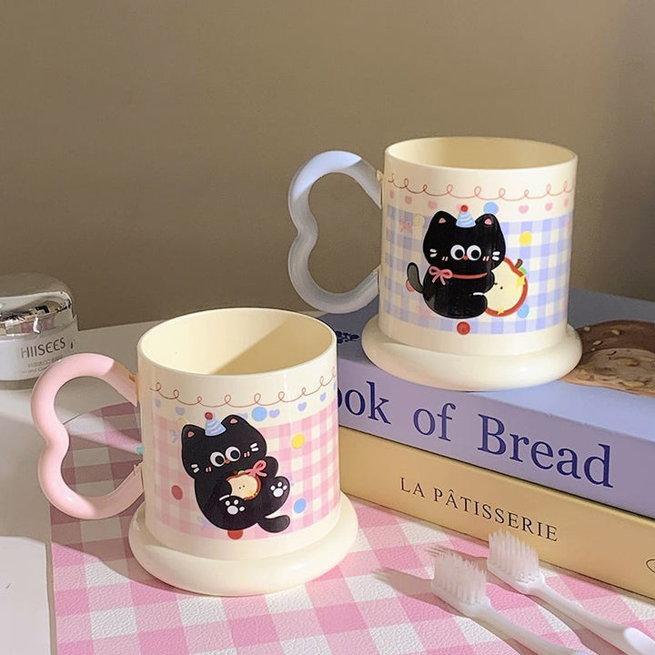 Ceramic mug with playful cat motif Stornfield