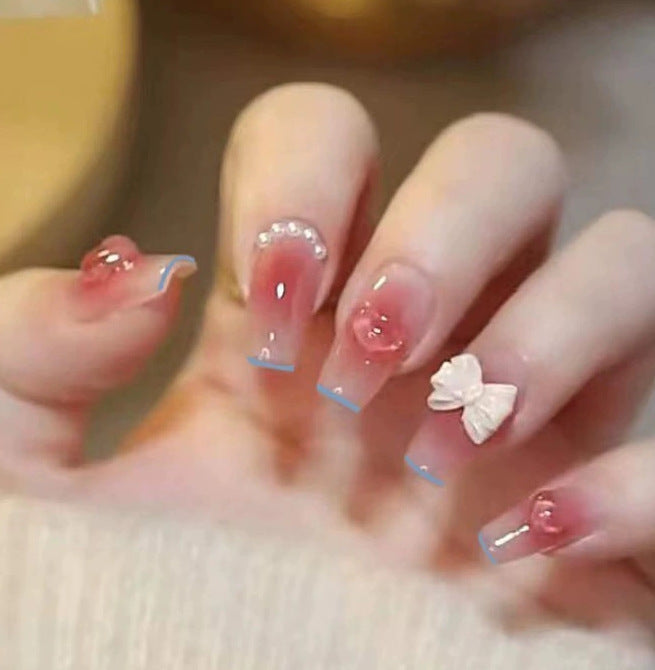 Elegant nail design with pearl embellishment Stornfield