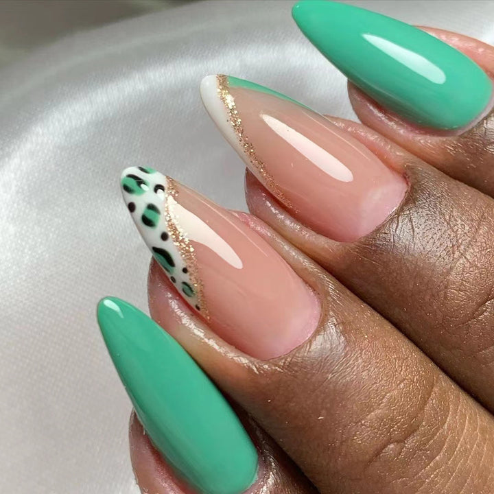 Artistic stiletto nails with glamorous color play Stornfield
