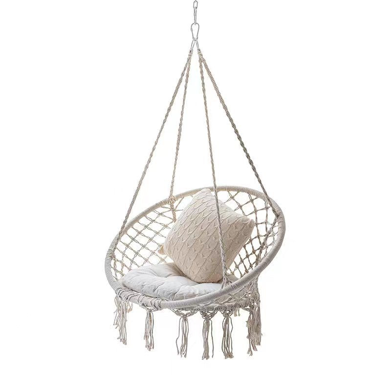 Boho macrame hanging swing chair with faux fur cushion and fringe Stornfield