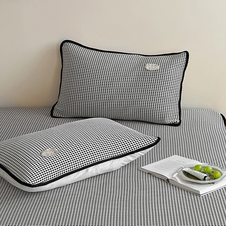 Cooling waffle structure pillow with breathable filling core and decorative piping