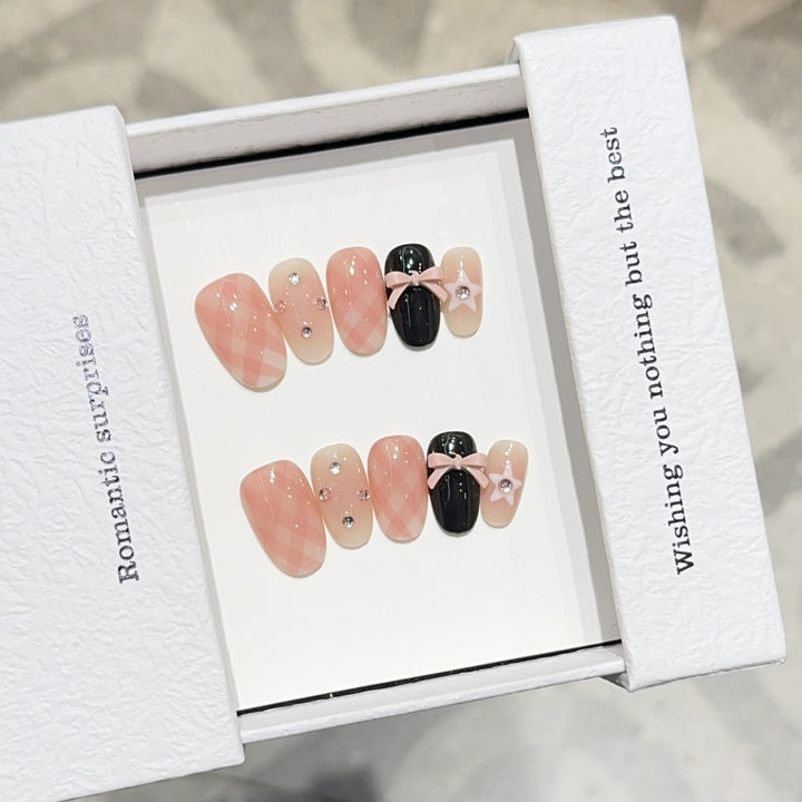 Artificial nails with romantic design and glitter details Stornfield