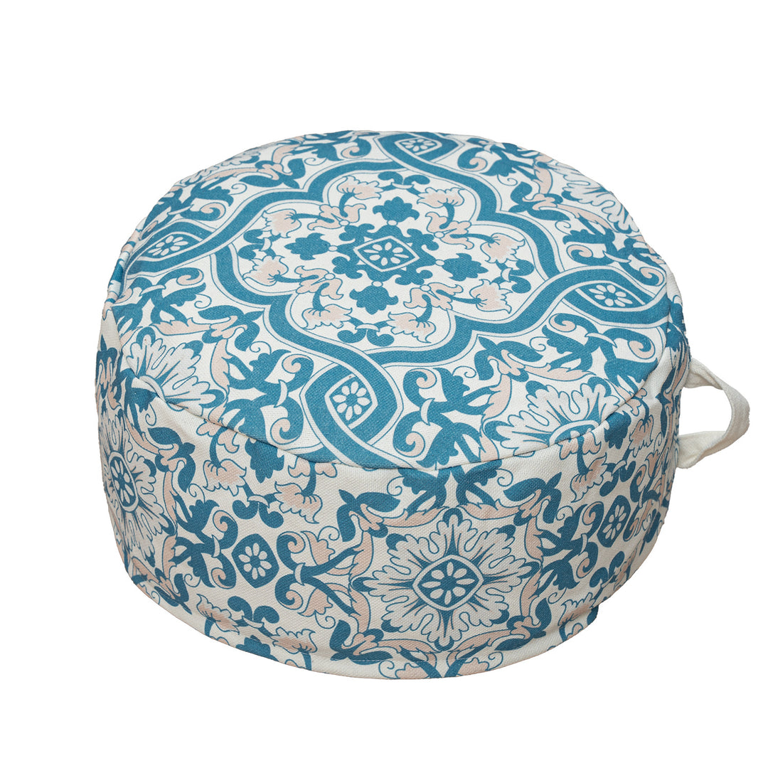 Round floor pouf with woven ornament pattern and carrying handle Stornfield