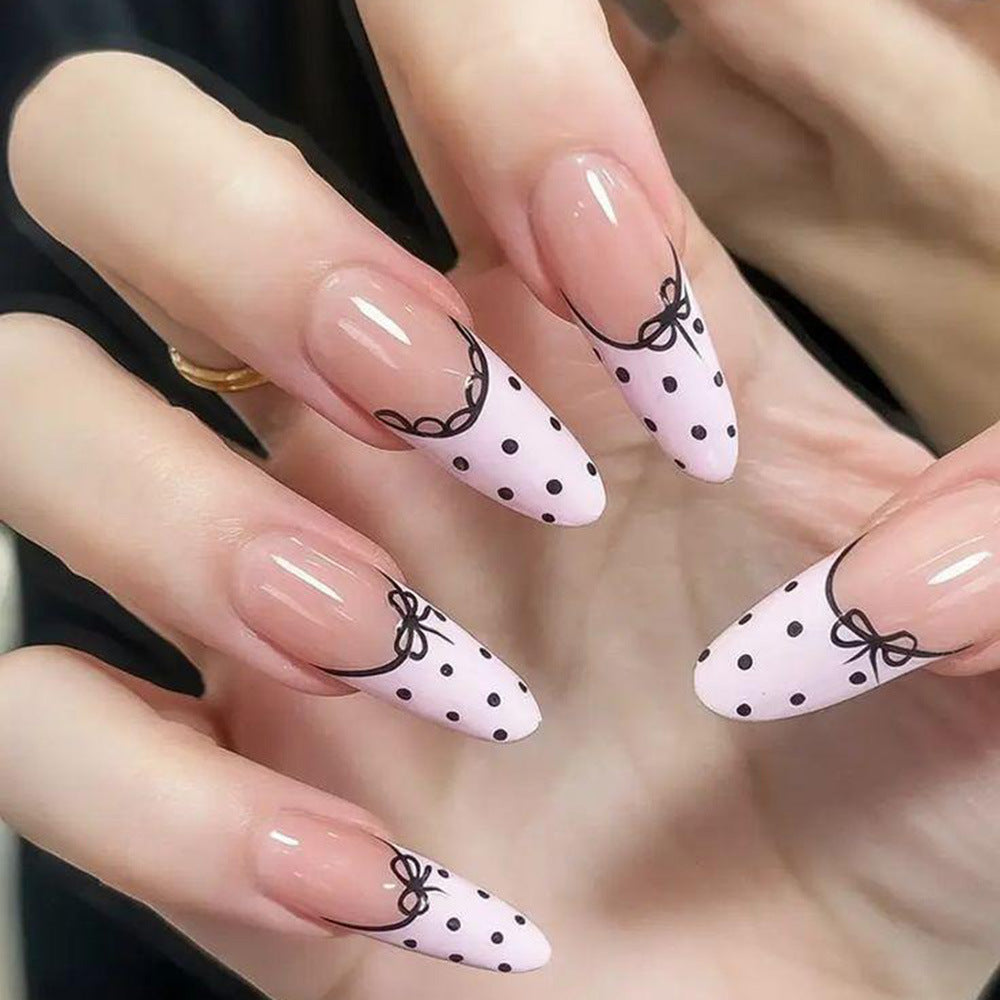 Elegant artificial nails with bow design and dots Stornfield