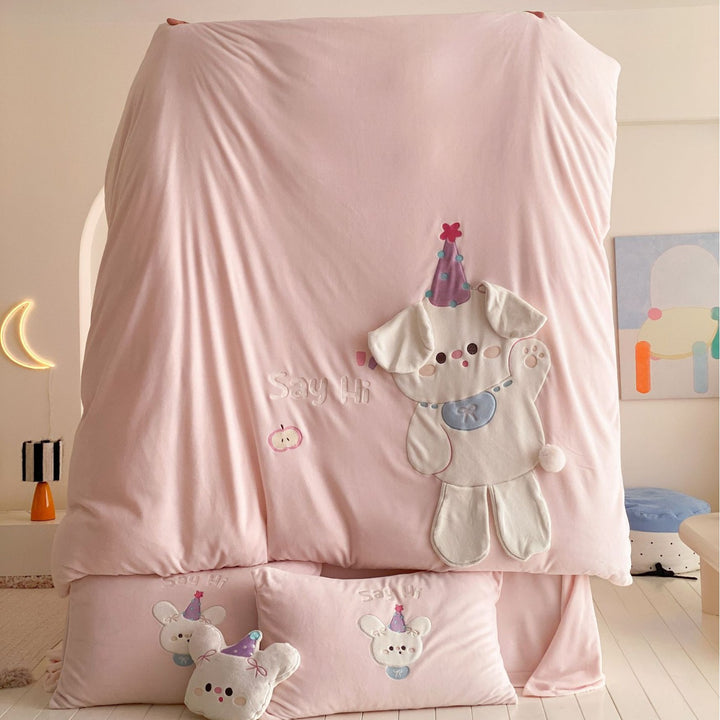 Children's bedding set with appliquéd cuddle bunny, quilted blanket and decorative pillows
