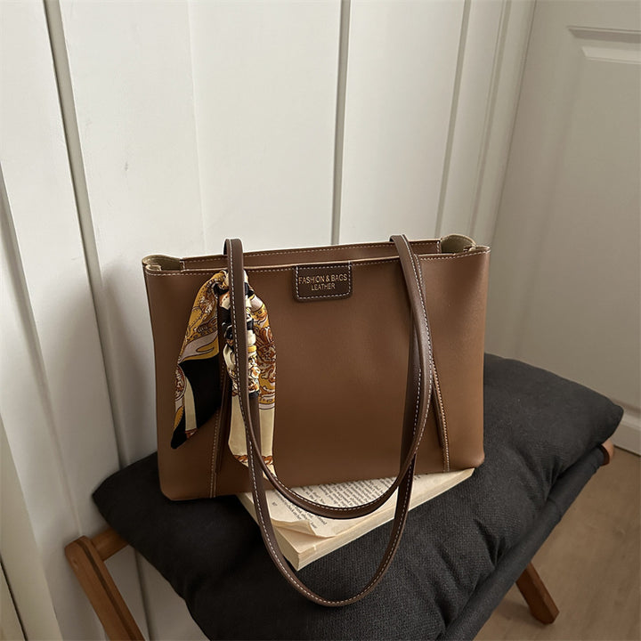 Elegant Leather Tote Bag with Decorative Scarf