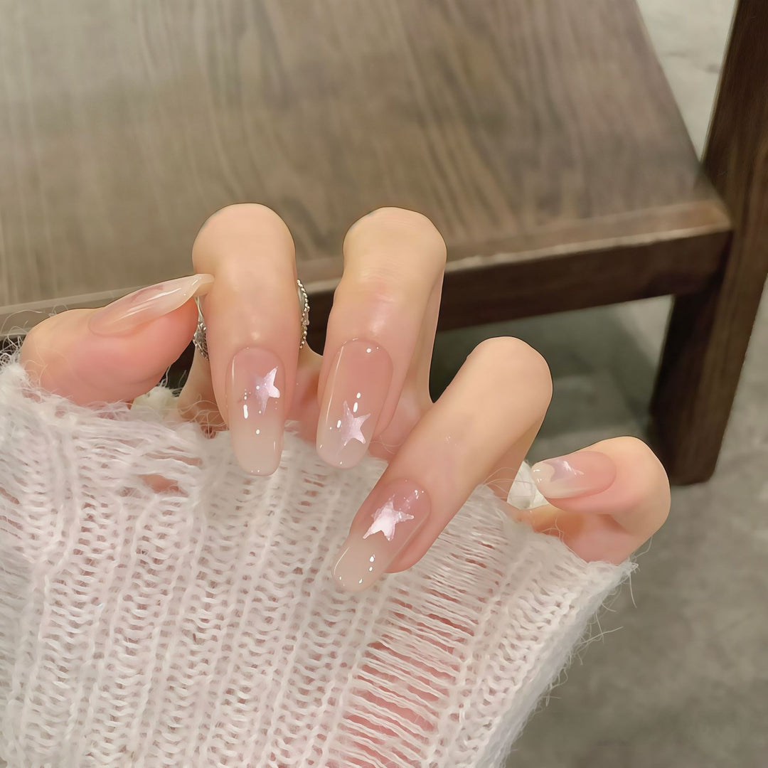 Artificial nails with sparkling stars and gentle gradient Stornfield