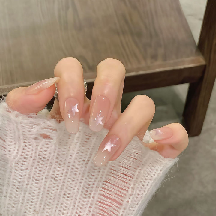 Artificial nails with sparkling stars and gentle gradient Stornfield