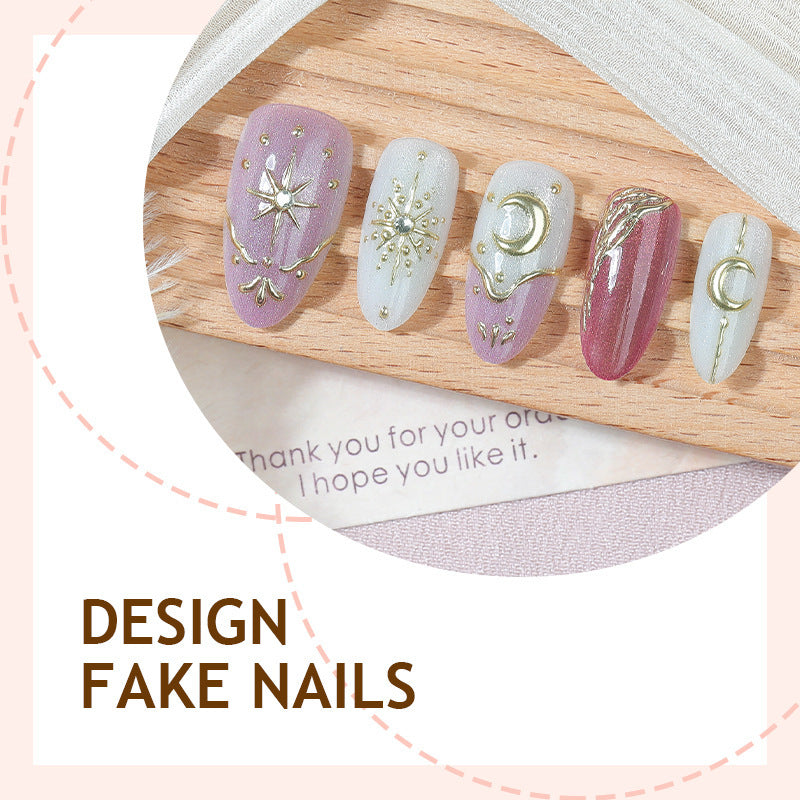 Artificial nail set with delicate gold embellishments and mystical motifs Stornfield