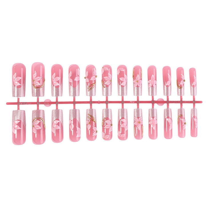 Elegant artificial nail set with floral designs and glitter accents Stornfield