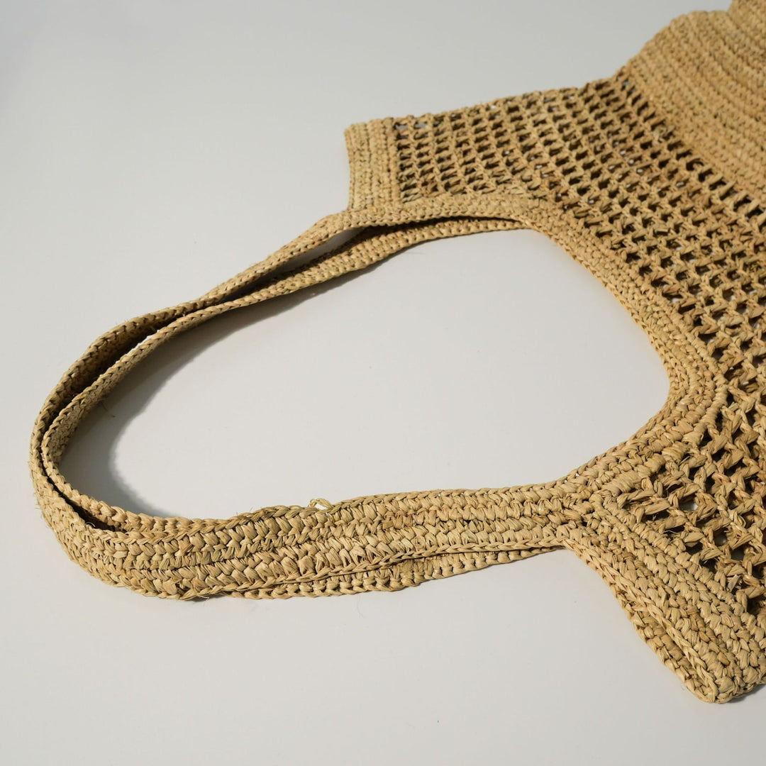 Hand-knotted raffia bag with generous interior Stornfield