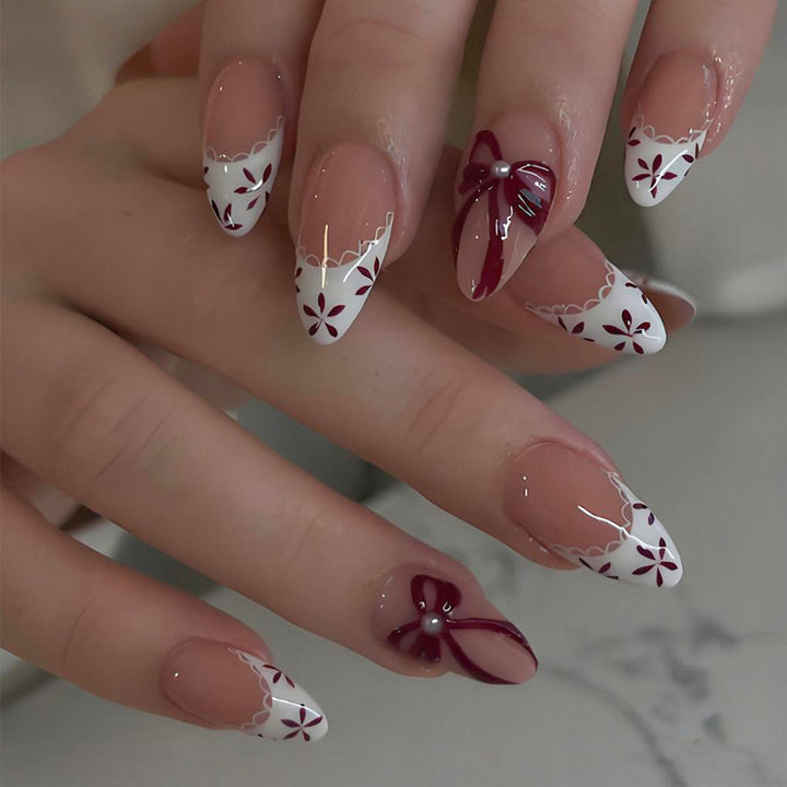 Artificial nail set with elegant bow and flower details Stornfield