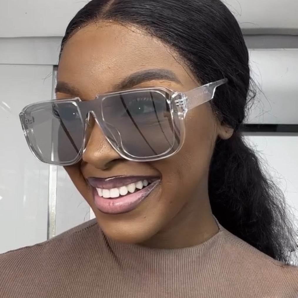 Ladies trendy square sunglasses with transparent green frame and protective UV filter Stornfield