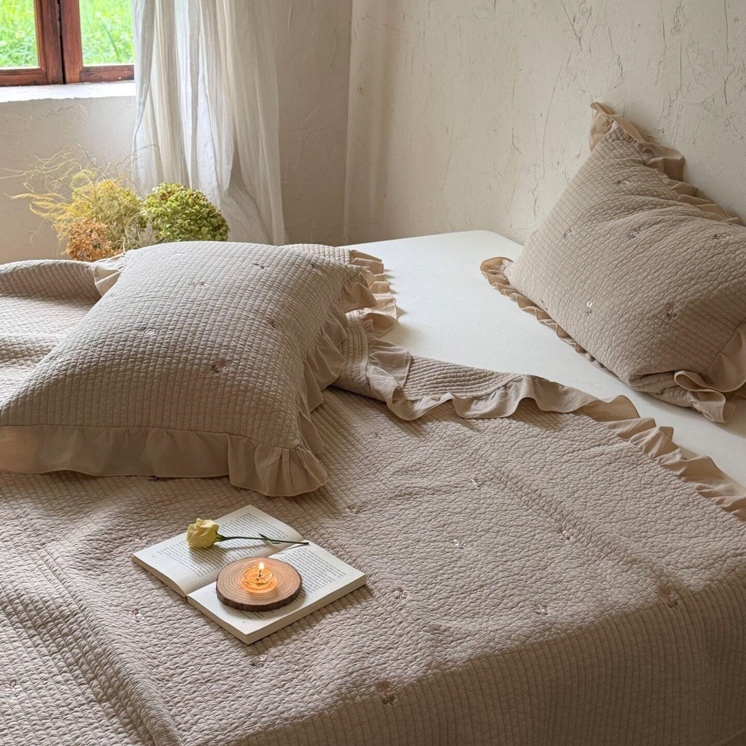 Quilted bedspread and cushion set with frill and delicate flower embroidery
