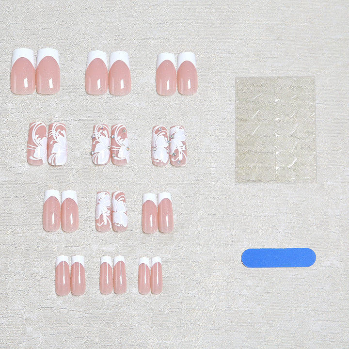 Artificial nails with floral embellishments and glitter details Stornfield