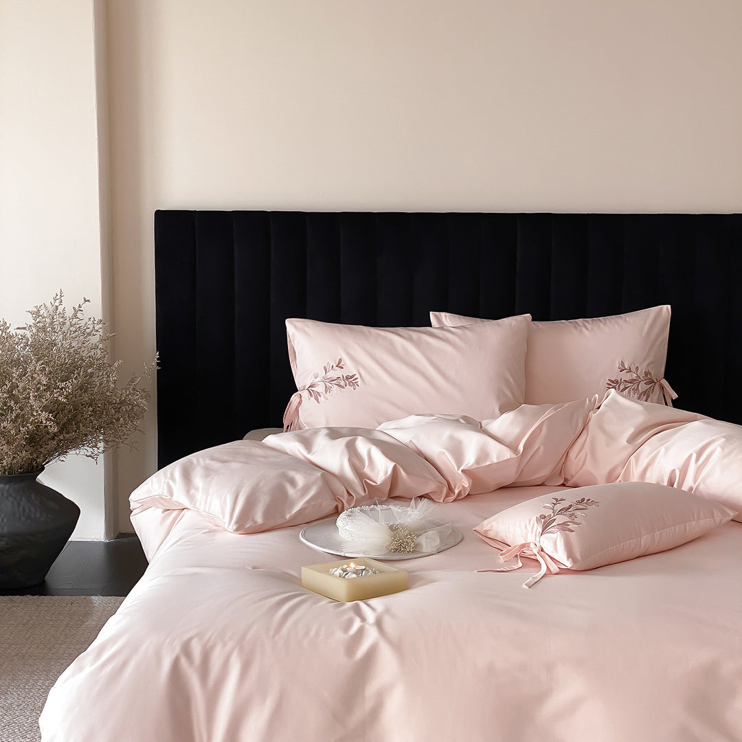Premium cotton satin bedding set with botanical embroidery and decorative cushion ties