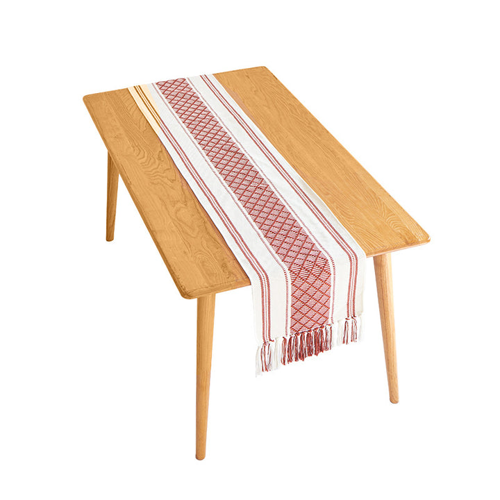 Handwoven cotton table runner with ethnic diamond pattern and fringes Stornfield